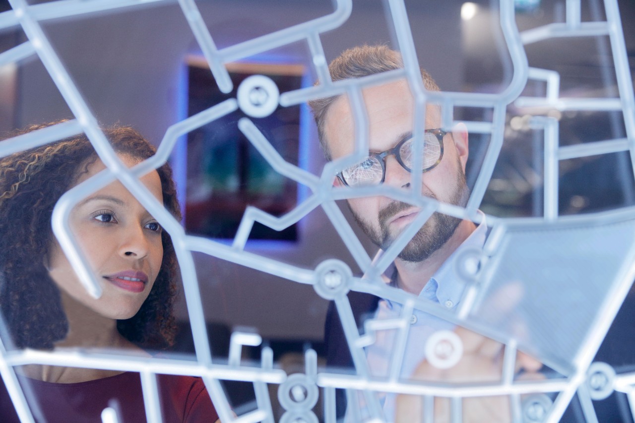 Man and woman looking a at grid map