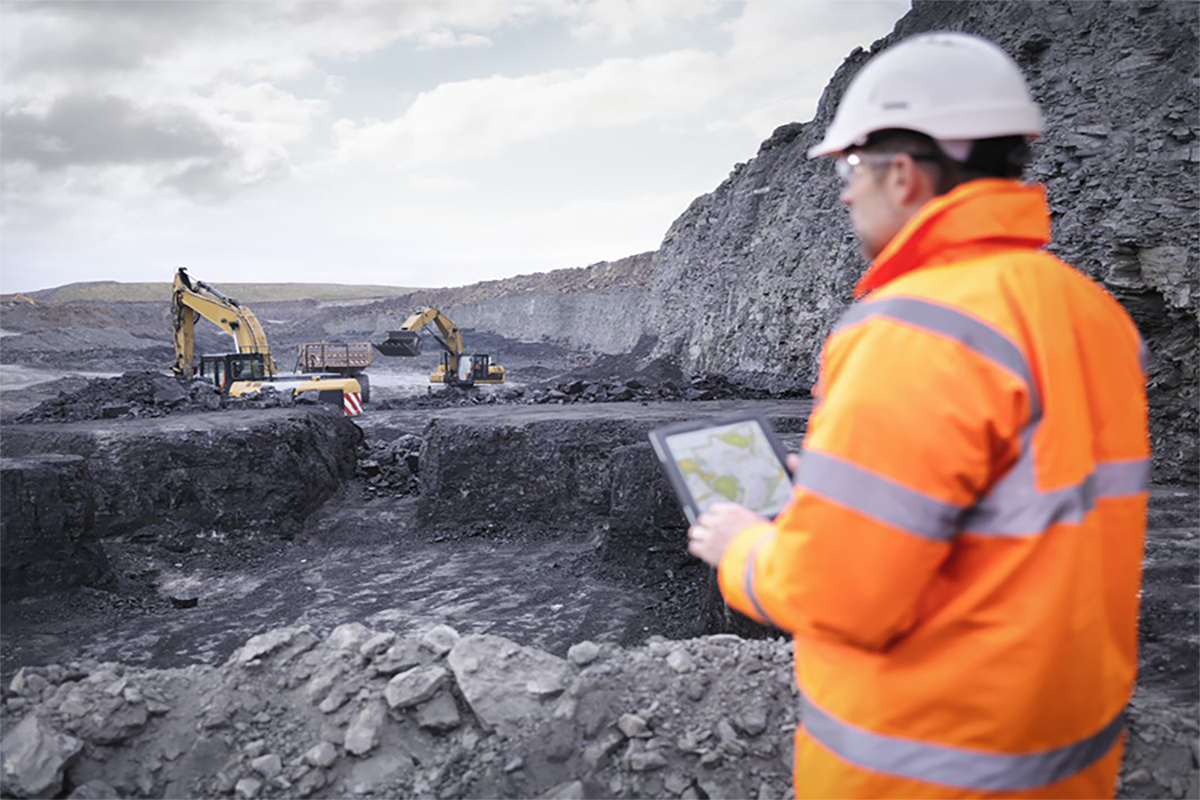 Mining worker with a tablet.png