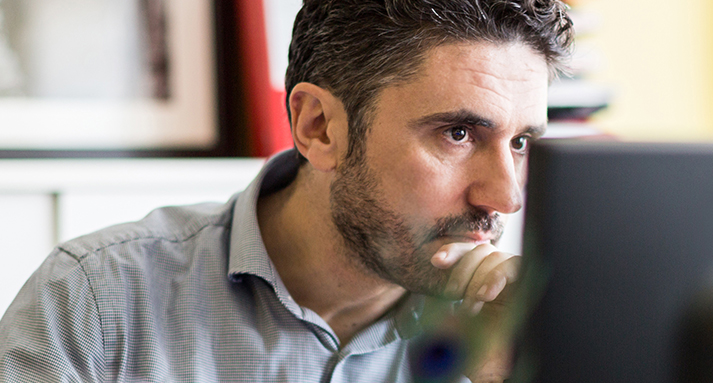 man-working-on-computer-cropped.jpg